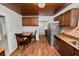 Eat-in kitchen with stainless appliances and wood cabinets and wood-look tile flooring at 5201 Dorman Rd, Lakeland, FL 33813