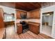 Cozy kitchen with wooden cabinets, modern appliances, and wood-look tile flooring at 5201 Dorman Rd, Lakeland, FL 33813