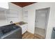 Laundry room with modern washer and dryer, sink, and storage at 5201 Dorman Rd, Lakeland, FL 33813
