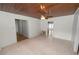 Bright, spacious living room with wood ceiling, ceiling fan, and tile flooring at 5201 Dorman Rd, Lakeland, FL 33813