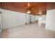 Bright, spacious living room with wood ceiling, ceiling fans, and neutral tile flooring at 5201 Dorman Rd, Lakeland, FL 33813