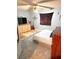 Cozy bedroom featuring a bed, dresser and a tv for relaxation and entertainment at 5218 Parkland Ct, Lakeland, FL 33811