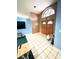 Welcoming foyer features tile flooring, a striking stained-glass window, and wood double-doors at 5218 Parkland Ct, Lakeland, FL 33811
