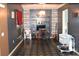 Cozy living room with distinctive flooring, built-in shelving, and a vintage chandelier at 5218 Parkland Ct, Lakeland, FL 33811