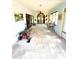 Enclosed sunroom with ample space, natural light, and potential for various uses at 5218 Parkland Ct, Lakeland, FL 33811