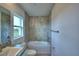 Neat bathroom featuring a white tub, toilet, shower and single granite sink with vanity at 535 Tanaro Ln, Haines City, FL 33844