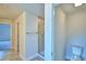 Bright bathroom view of a shower, toilet and doorway to another room at 535 Tanaro Ln, Haines City, FL 33844