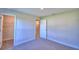Bright carpeted bedroom with white walls, doors and trim and natural lighting at 535 Tanaro Ln, Haines City, FL 33844