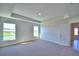 Bright bedroom with large windows offering picturesque views of the surrounding landscape at 535 Tanaro Ln, Haines City, FL 33844