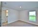 Bright bedroom with neutral carpet, white walls, baseboards and trim and lots of natural light at 535 Tanaro Ln, Haines City, FL 33844