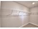Walk-in closet with carpet and metal shelving provides ample space for organized storage at 535 Tanaro Ln, Haines City, FL 33844