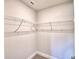 A simple empty closet with wire shelving against painted walls and new carpeted floors at 535 Tanaro Ln, Haines City, FL 33844