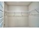 Open walk-in closet featuring wire shelving for easy organization at 535 Tanaro Ln, Haines City, FL 33844