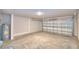 The spacious garage is ready for vehicles with a functional water heater installed and a garage door with windows at 535 Tanaro Ln, Haines City, FL 33844