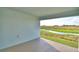 View from covered patio showing pond, wetlands and bright blue sky in the distance at 535 Tanaro Ln, Haines City, FL 33844