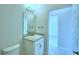 Contemporary bathroom featuring a granite countertop vanity and a neutral color scheme at 539 Tanaro Ln, Haines City, FL 33844