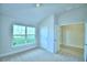 Bright bedroom with carpet, and large windows offering outdoor views at 539 Tanaro Ln, Haines City, FL 33844
