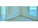 Bright bedroom featuring carpet floors, neutral walls, and a large window at 539 Tanaro Ln, Haines City, FL 33844