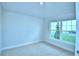 Neutral bedroom with carpet, window, and ample natural light at 539 Tanaro Ln, Haines City, FL 33844