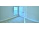 Cozy bedroom with carpet floors, a window for natural light, and a closet at 539 Tanaro Ln, Haines City, FL 33844