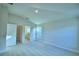 Spacious bedroom with an open door to a bathroom and a window at 539 Tanaro Ln, Haines City, FL 33844