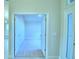 Open doorway into carpeted bedroom with views of other rooms at 539 Tanaro Ln, Haines City, FL 33844