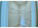 Walk-in closet featuring built-in shelving units for storage at 539 Tanaro Ln, Haines City, FL 33844