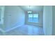 Bright dining room with tile floors and a modern chandelier at 539 Tanaro Ln, Haines City, FL 33844