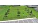 Aerial view of a well-maintained dog park with play structures and ample green space at 539 Tanaro Ln, Haines City, FL 33844