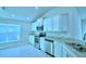 A bright kitchen with white cabinets and stainless steel appliances at 539 Tanaro Ln, Haines City, FL 33844