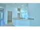 Kitchen island with stone countertops and stainless steel sink overlooking the home at 539 Tanaro Ln, Haines City, FL 33844