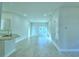 Open-concept living space with tile flooring, recessed lighting, and natural light at 539 Tanaro Ln, Haines City, FL 33844