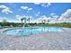 Wheelchair accessible community pool featuring an access lift and plenty of space for relaxation at 539 Tanaro Ln, Haines City, FL 33844