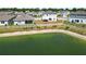 Aerial perspective of the property, showcasing a lakefront location, fenced yard, and serene neighborhood at 5463 Arlington River Dr, Lakeland, FL 33811