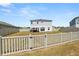 Spacious fenced backyard with a white picket fence, perfect for outdoor activities and relaxation at 5463 Arlington River Dr, Lakeland, FL 33811