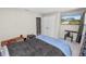 Bedroom showcasing an installed TV and furniture alongside a well-maintained closet and door frame at 5463 Arlington River Dr, Lakeland, FL 33811