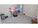 Carpeted bedroom featuring a white loft bed with a ladder, with curtains and other furniture at 5463 Arlington River Dr, Lakeland, FL 33811