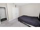 Bedroom with a gray carpet, showing double closet door, and bed at 5463 Arlington River Dr, Lakeland, FL 33811