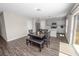 Open floor plan with dinning area that combines the stainless kitchen with table and bench at 5463 Arlington River Dr, Lakeland, FL 33811