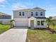 Beautiful two-story home with a well manicured lawn, two car garage and inviting entryway at 5463 Arlington River Dr, Lakeland, FL 33811