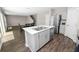 Open kitchen with stainless steel appliances, quartz counters and an island at 5463 Arlington River Dr, Lakeland, FL 33811