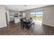 Kitchen featuring stainless appliances, quartz countertops, gray cabinets and a view of the lake at 5463 Arlington River Dr, Lakeland, FL 33811