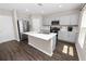 Kitchen featuring stainless appliances, quartz countertops, and ample cabinet space at 5463 Arlington River Dr, Lakeland, FL 33811