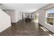 Spacious living area featuring wood floors flowing into a dining and kitchen area at 5463 Arlington River Dr, Lakeland, FL 33811