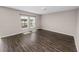 A cozy living room with hardwood floors, natural light and views of the backyard at 5463 Arlington River Dr, Lakeland, FL 33811