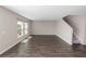 A spacious living room with hardwood floors, natural light, and a staircase at 5463 Arlington River Dr, Lakeland, FL 33811