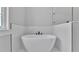 Bright bathroom featuring a sleek, modern soaking tub and minimalist black fixtures at 5508 Odom, Lakeland, FL 33809