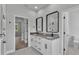 Modern bathroom featuring granite countertops and double sinks with black hardware at 5508 Odom, Lakeland, FL 33809