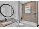 Bathroom with modern vanity, large mirror, shower and bathtub at 5508 Odom, Lakeland, FL 33809