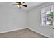 Bright bedroom featuring wood-look flooring and a modern ceiling fan at 5508 Odom, Lakeland, FL 33809